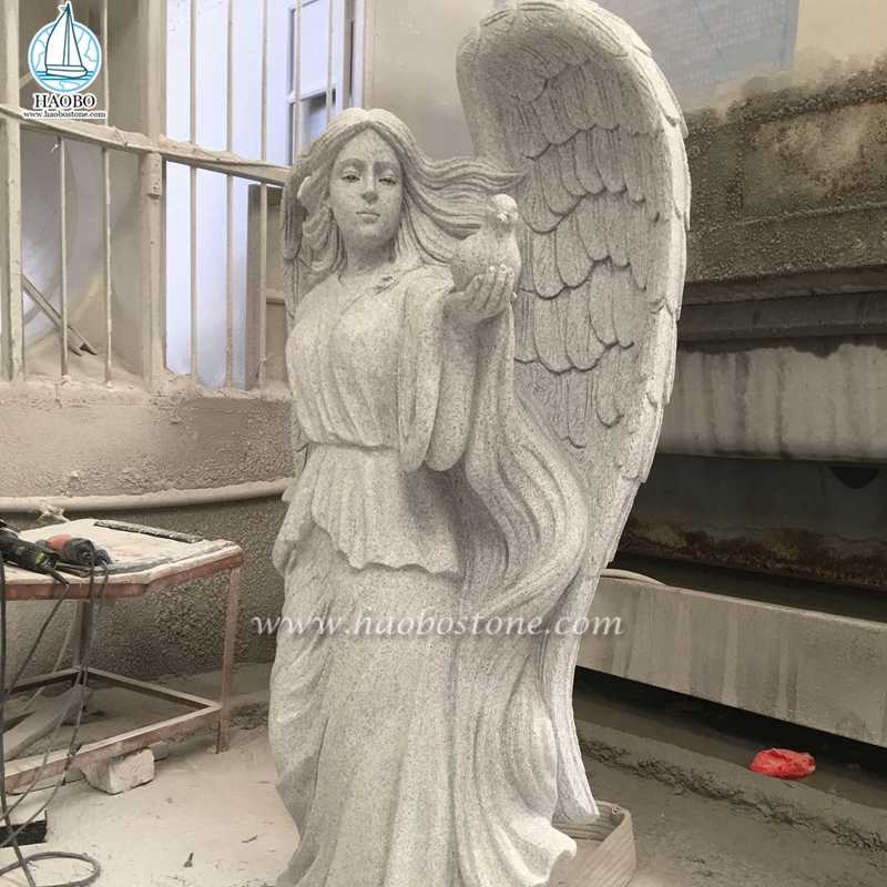 Индивидуальный ангел из белого гранита, держащий статую голубя
