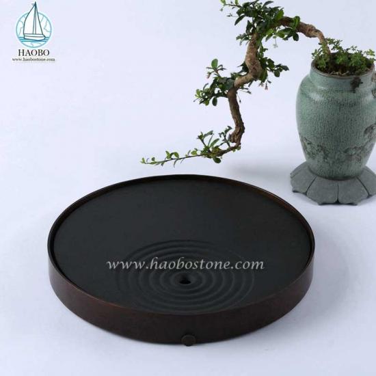 Поднос для чая из черного гранита с резьбой по камню круглой формы
